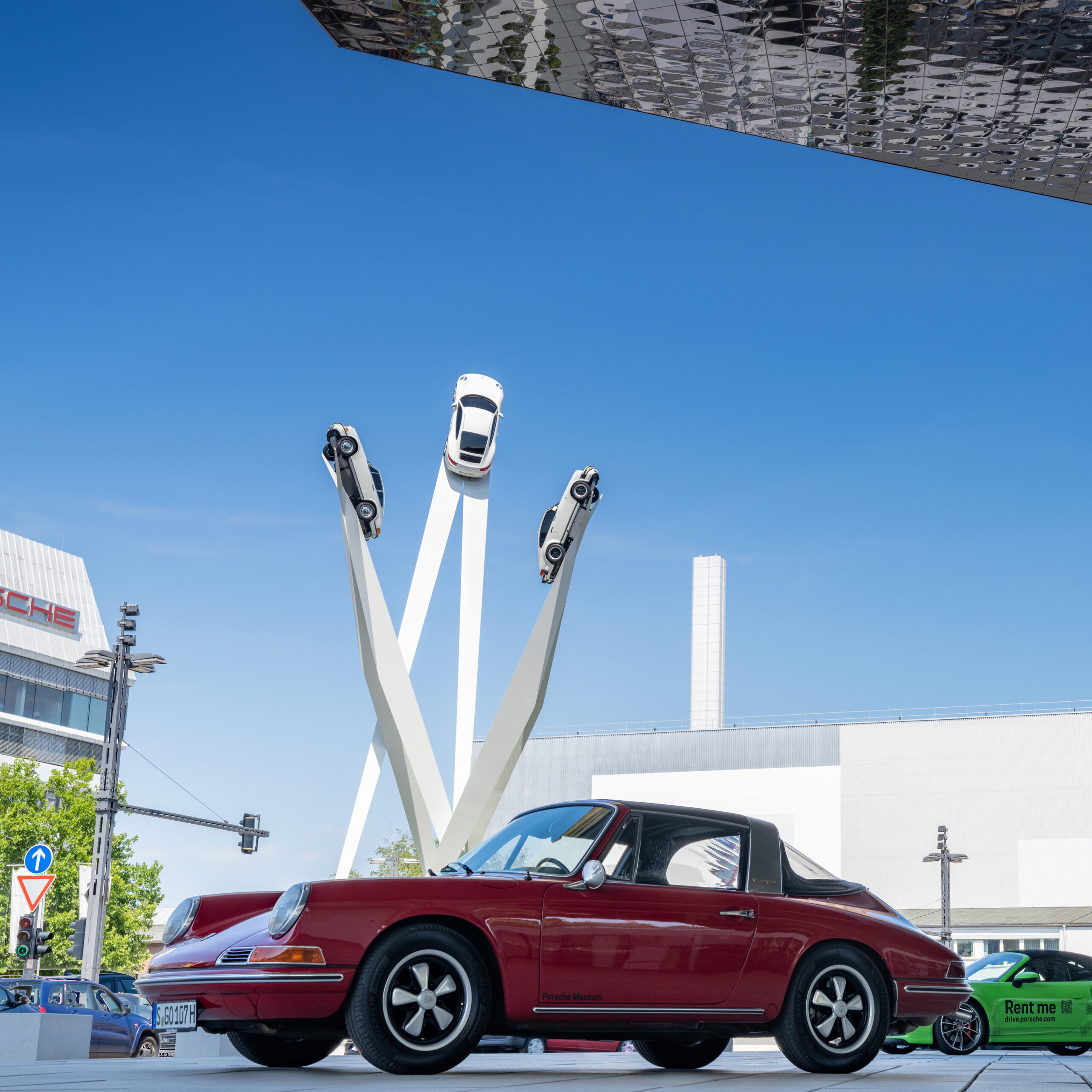 view of the Porsche museum in Stuttgart with a red 911 car in th